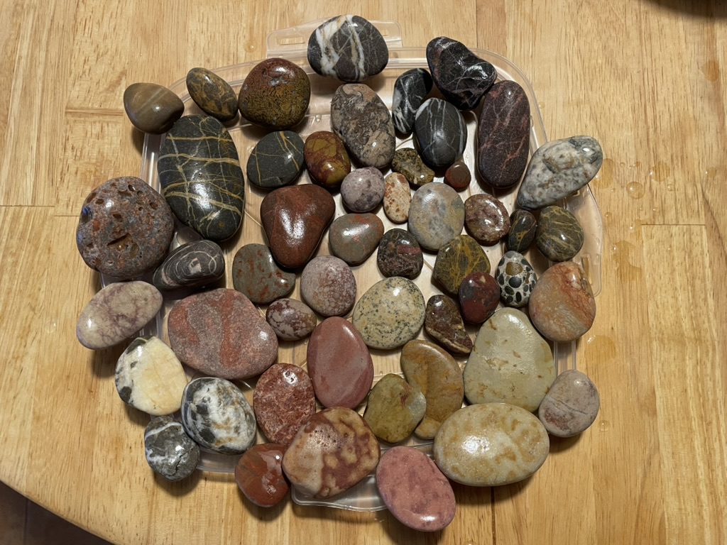 Tray of polished stones in many colors